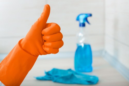 Technician using approved cleaning products with care