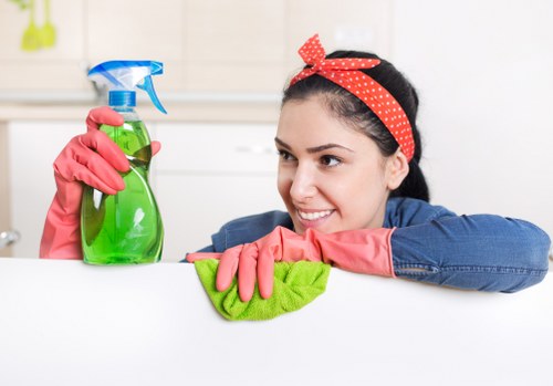 Cleaner preparing carpet cleaning equipment before a job